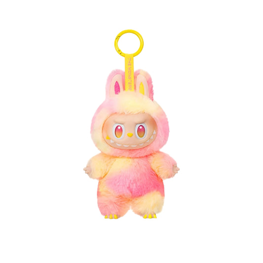 Plush toy with bunny ears and a yellow clip on a white background